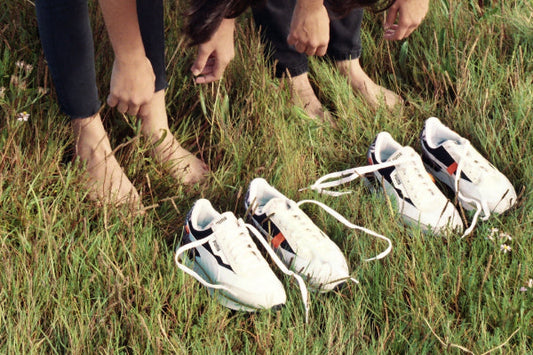 Women With Two Pairs of Puma Trainers