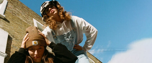 Two women wearing Carhartt WIP streetwear clothing