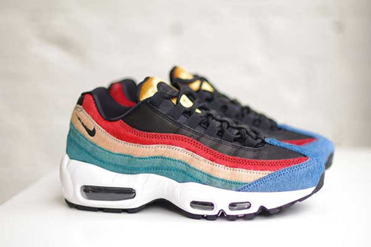 Nike Air Max 95 Premium with multicolour pony hair waves in teal, tan and red, a blue toe, black upper and white midsole with visible Air units.